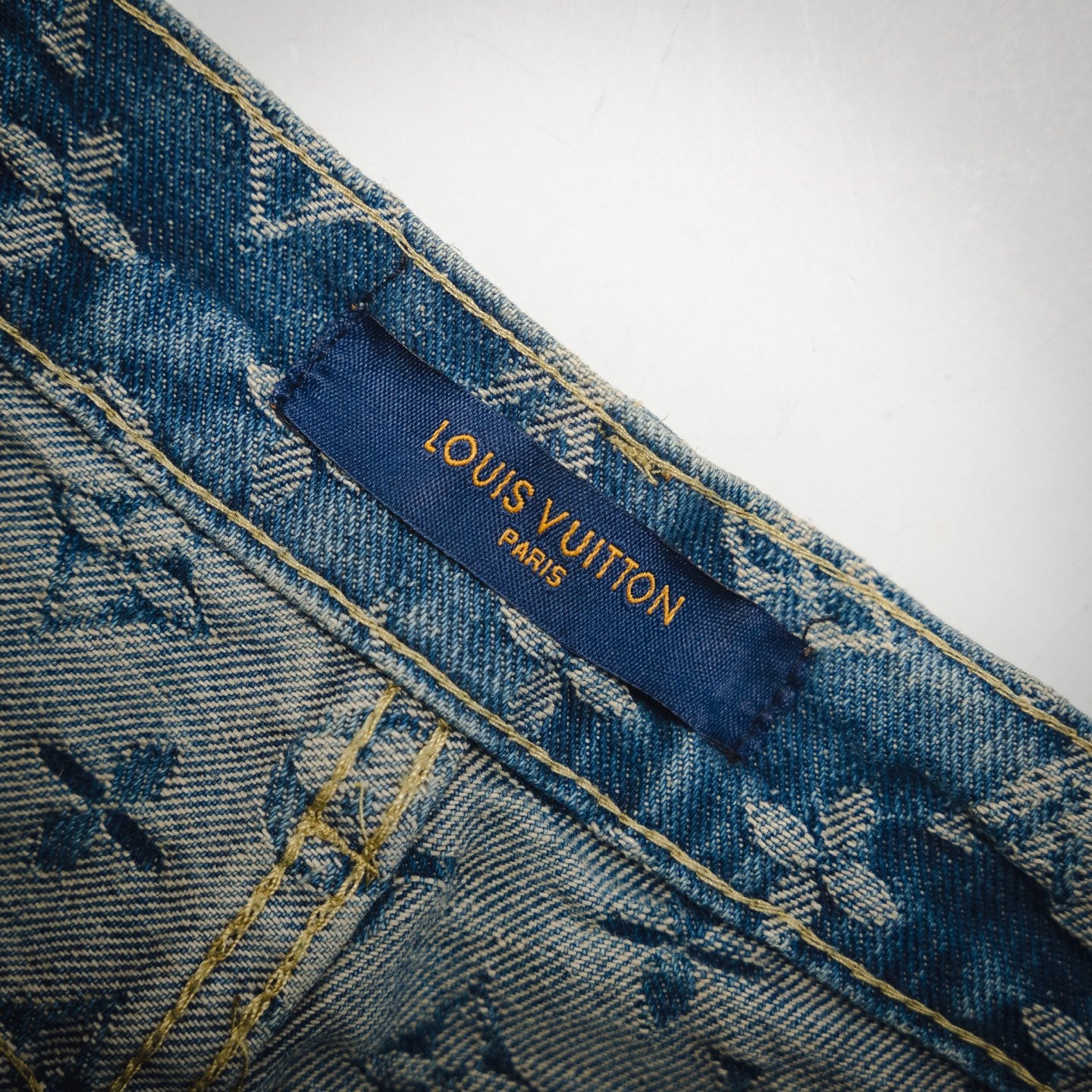1V Jacquard side leather jeans