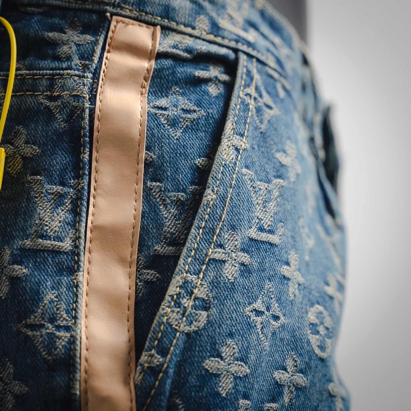 1V Jacquard side leather jeans