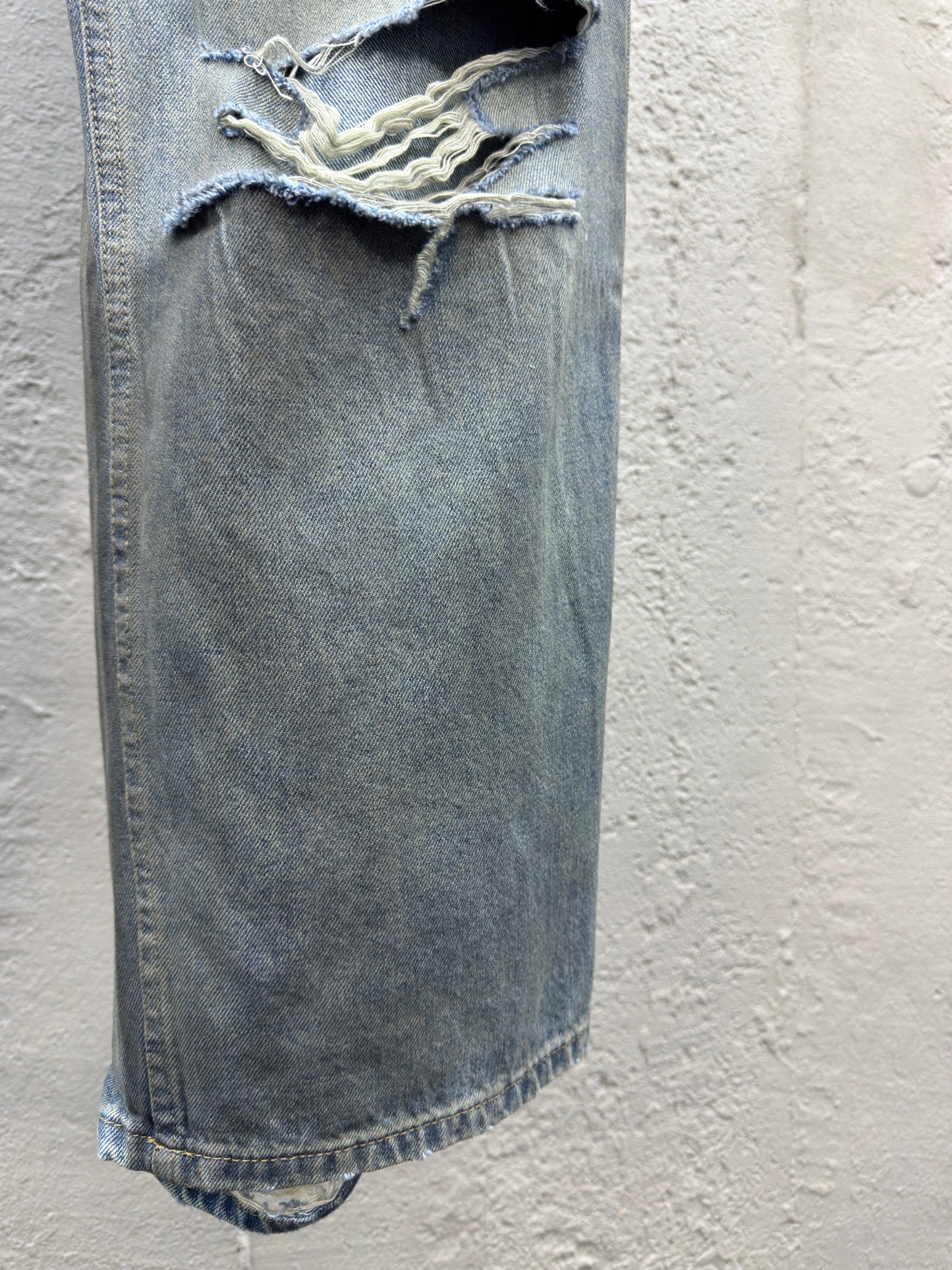 B jeans with fringe rips
